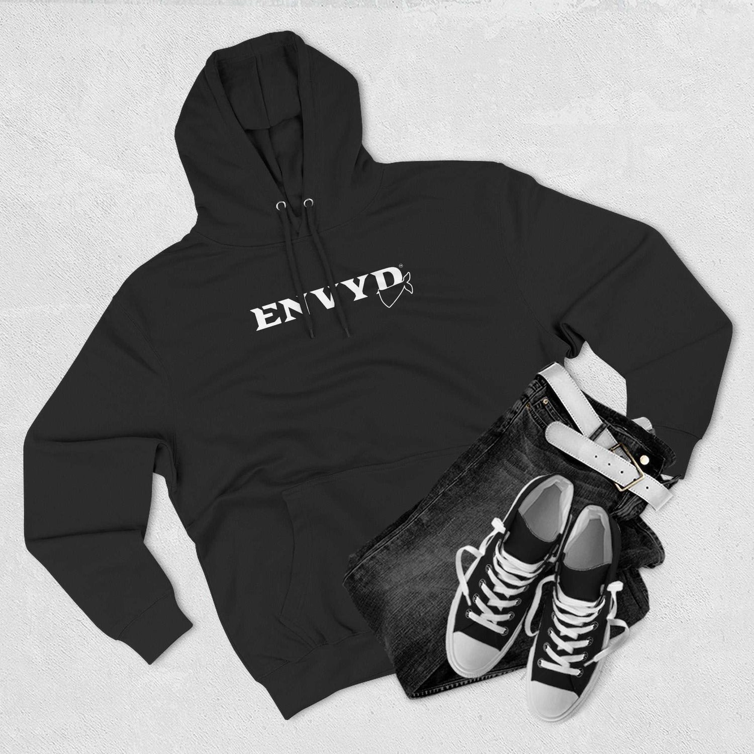 Variety of stylish hoodies in different colors and designs displayed on hangers